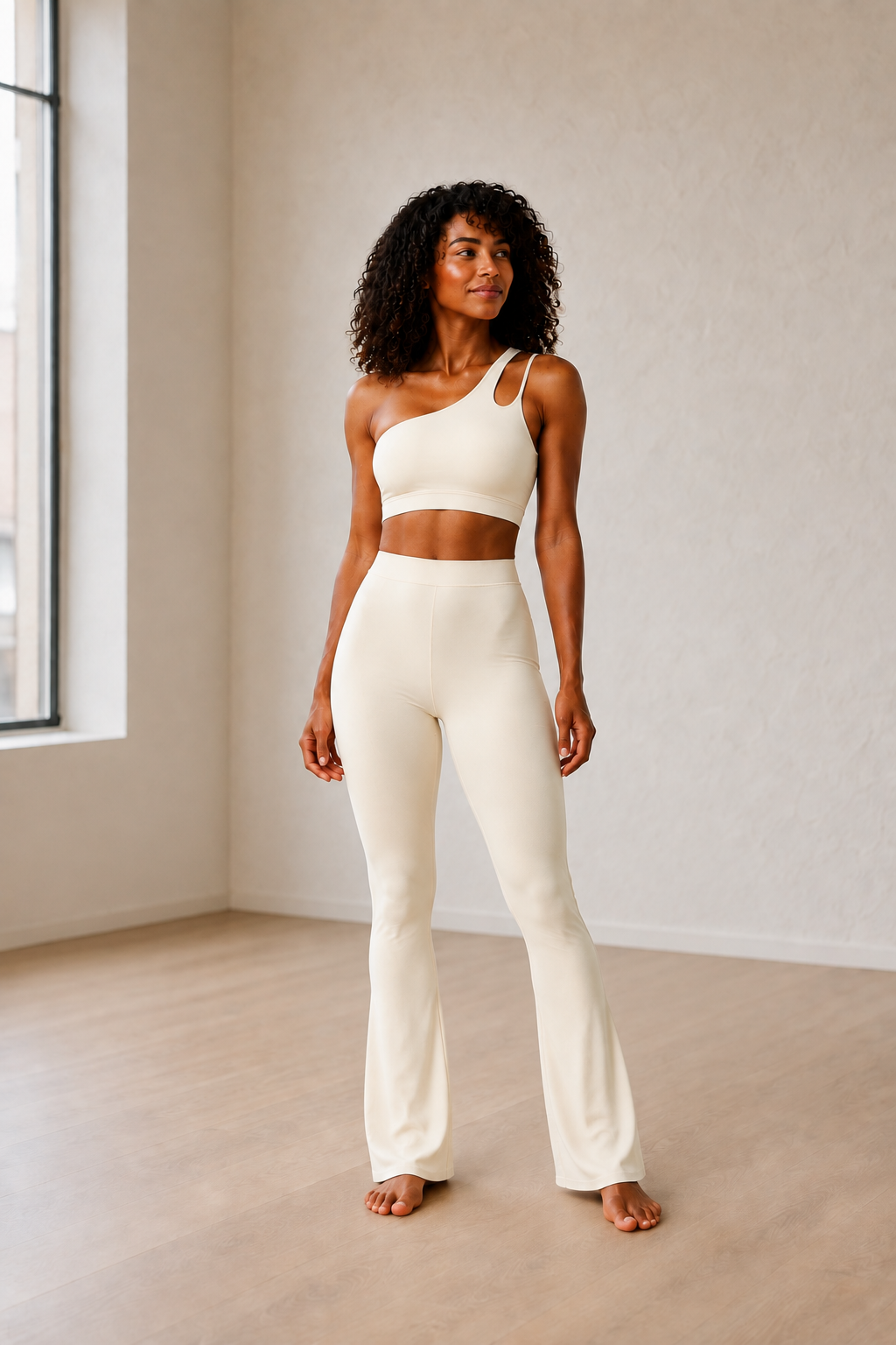 Ivory One-Shoulder Cutout Top and Flare Pants Set front view on model