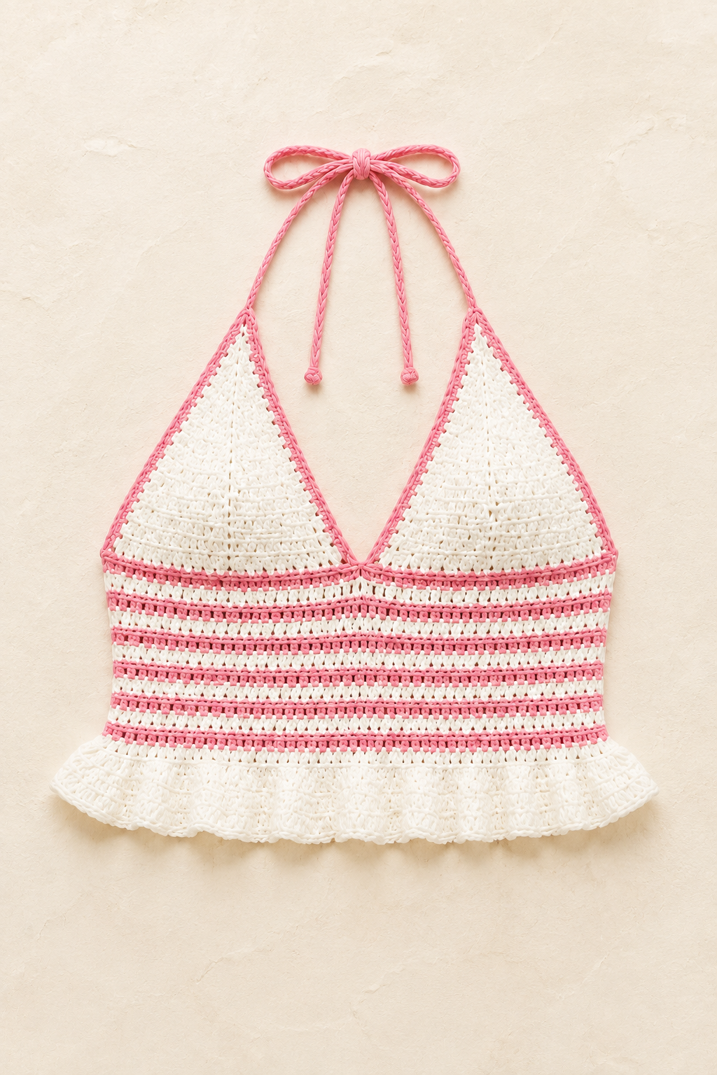 Pink crochet halter top, studio view, single garment shown