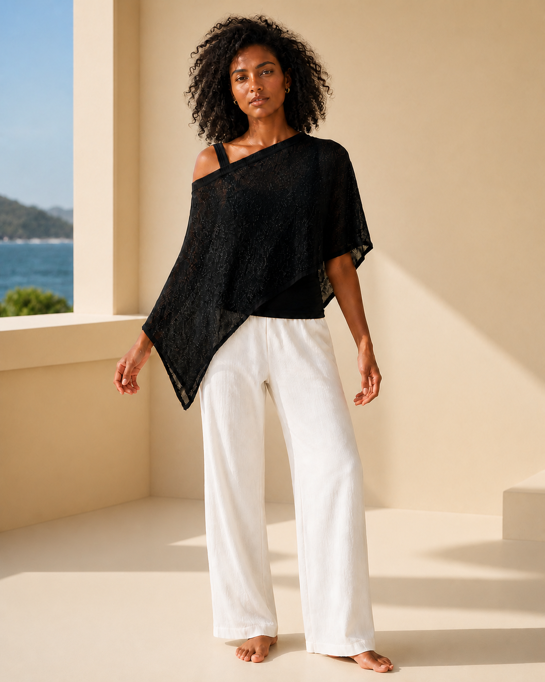 Black knit and sheer batwing poncho, front view on a third model