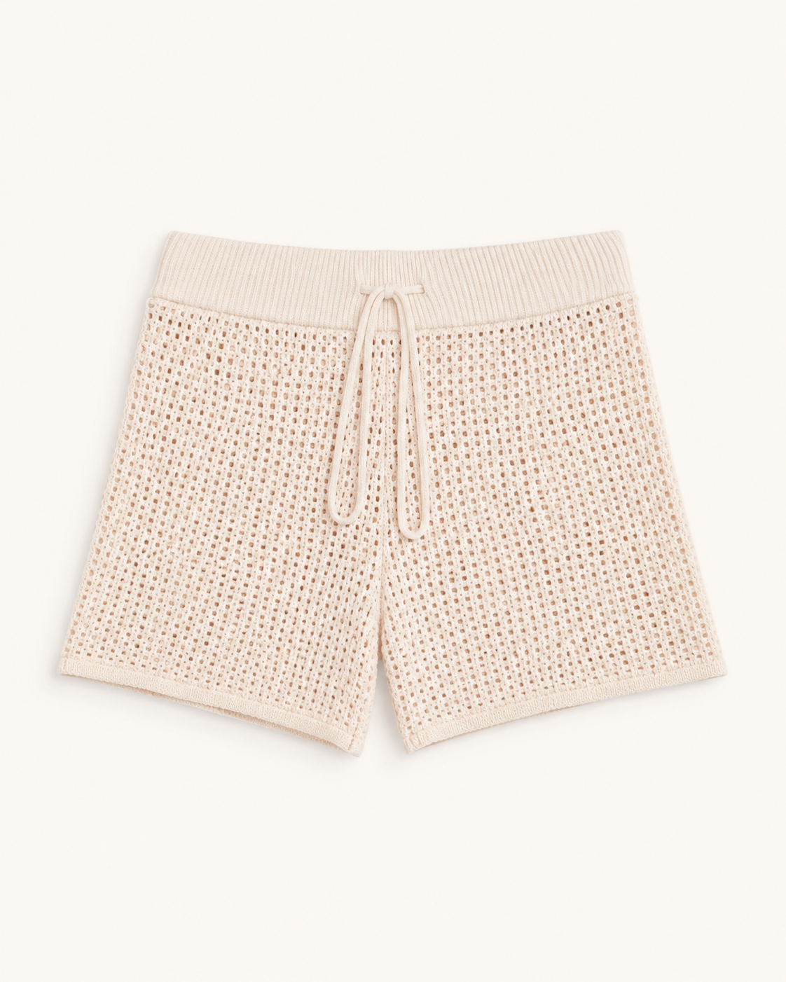 Cream blush knit shorts with a drawstring waistband, standalone studio view