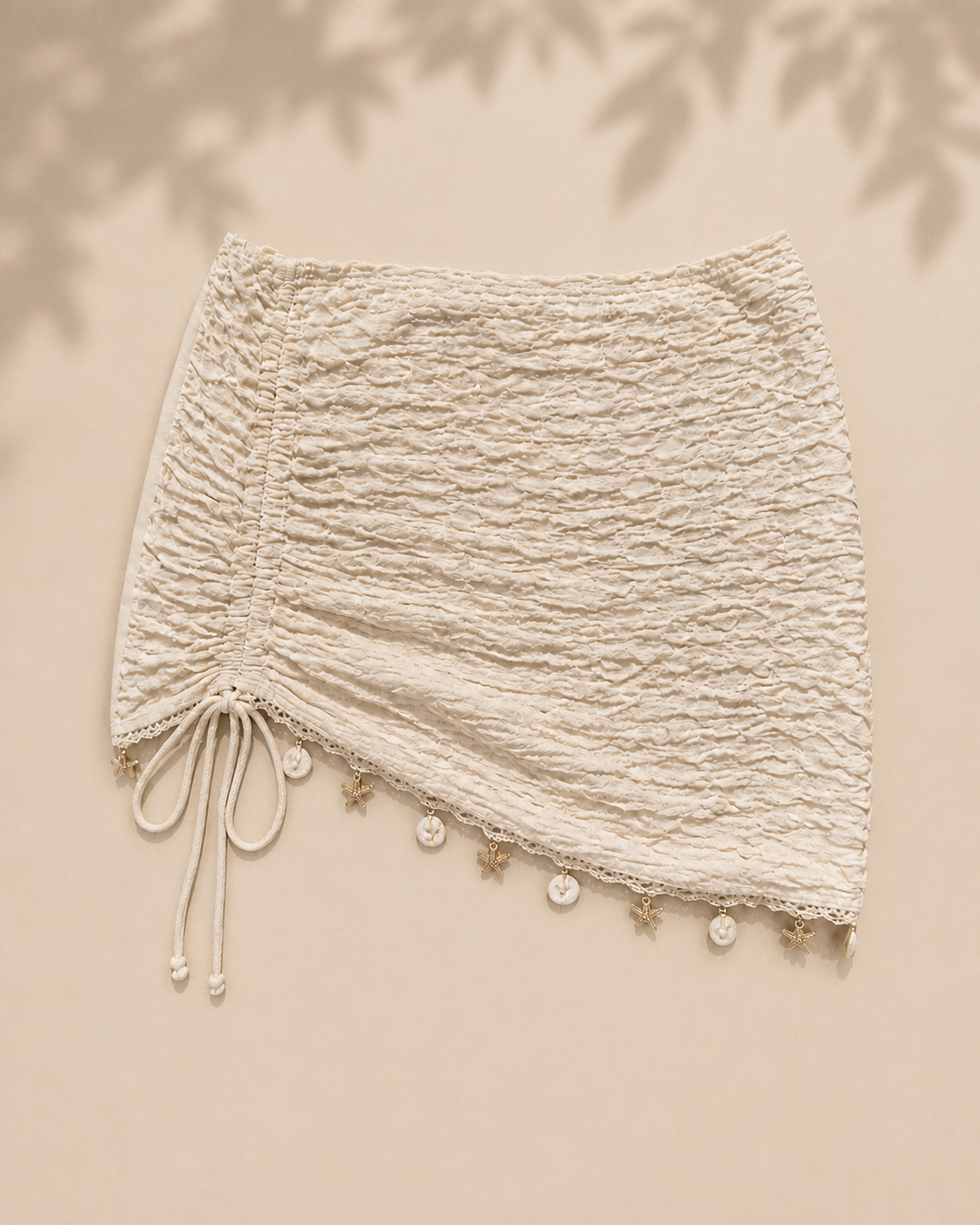Cream mini beach skirt, flat lay, full garment shown