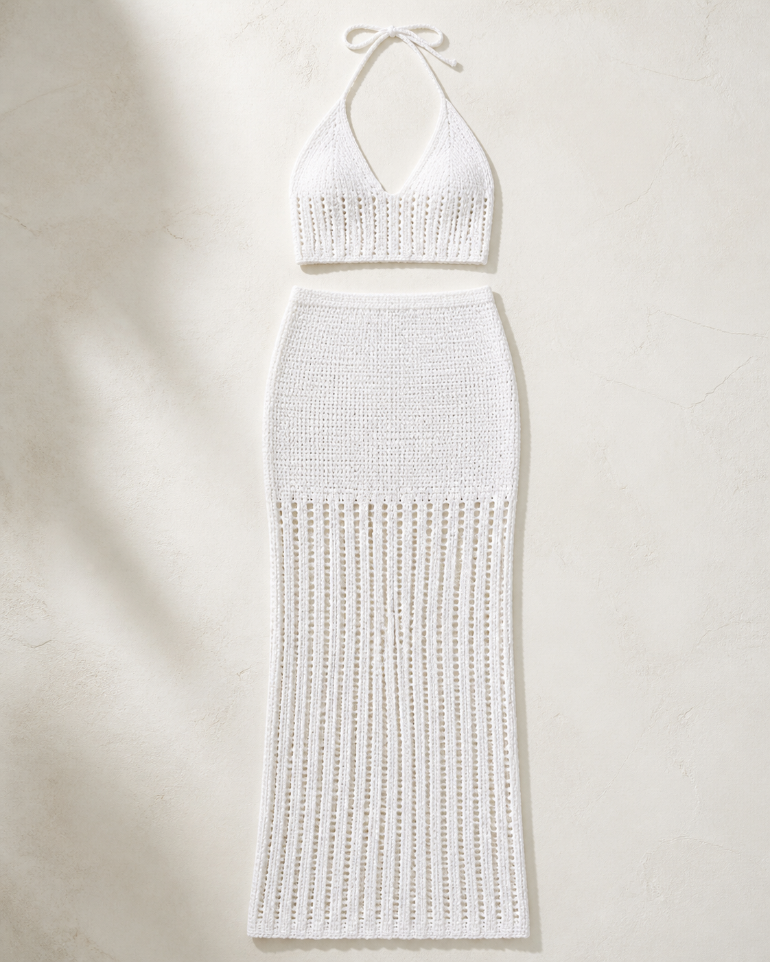 White crochet knit halter top and maxi skirt set, studio flat lay