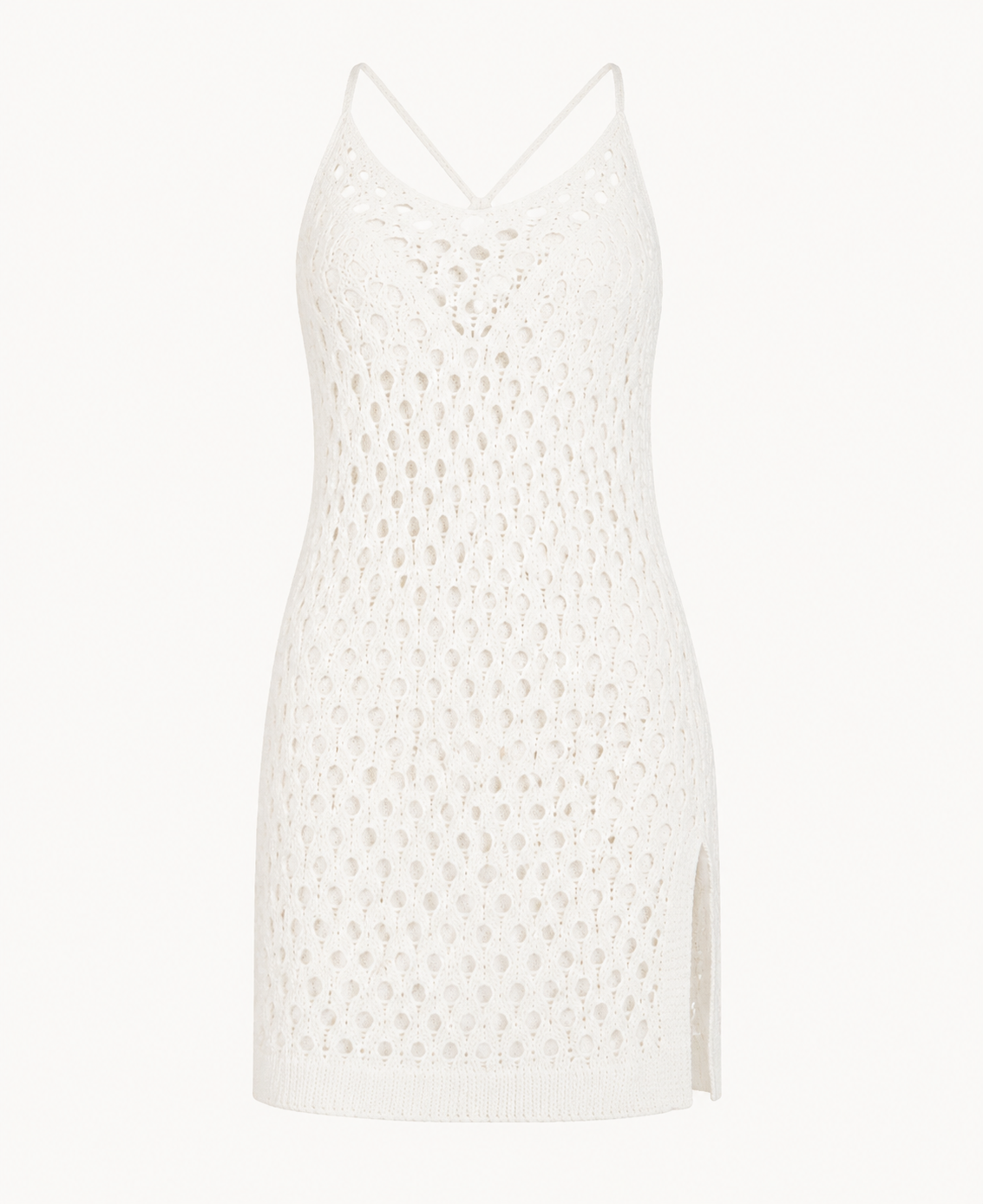 White crochet eyelet cami mini dress detail showing the fine straps, eyelet pattern, side slits, and short hem.