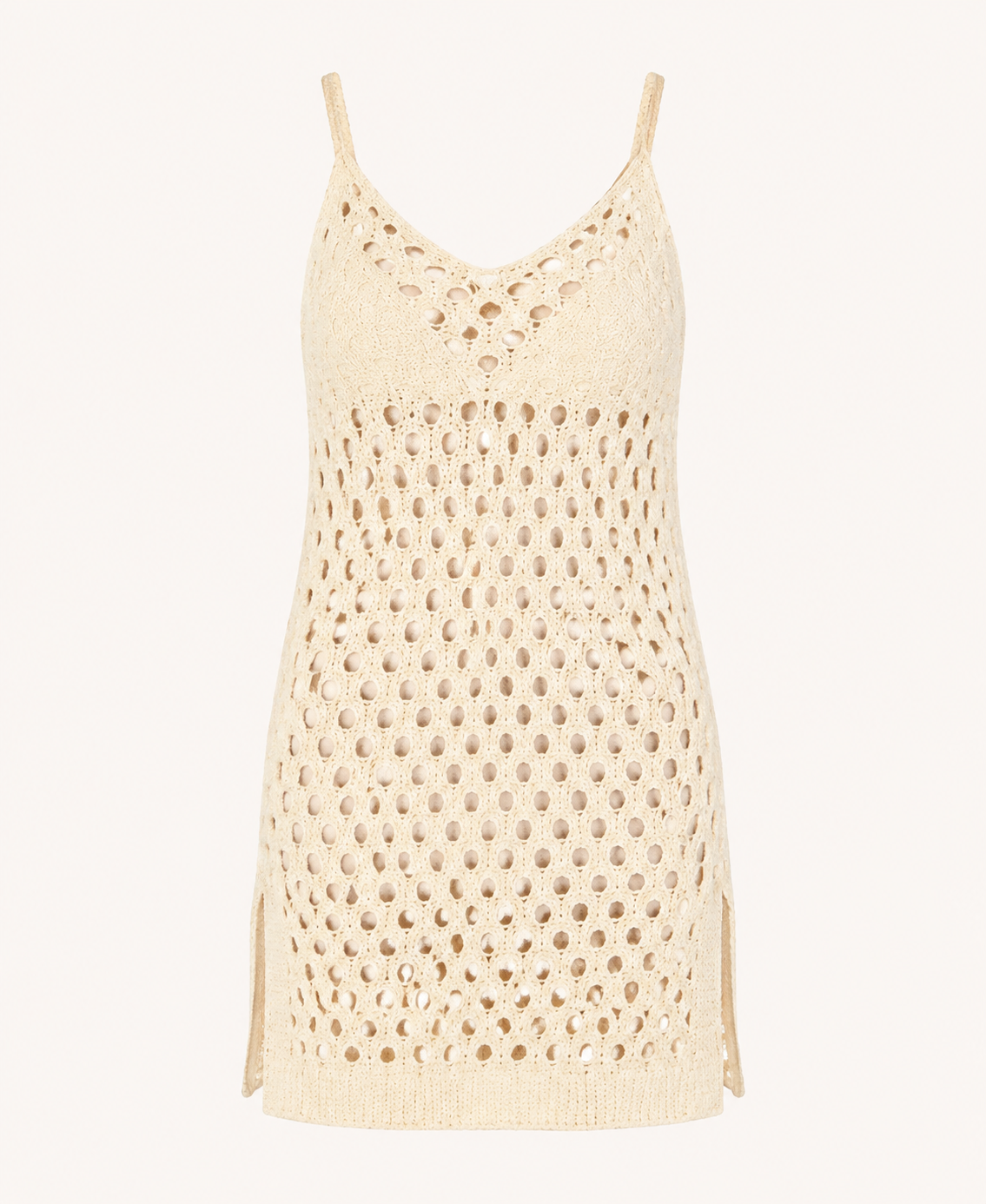 Cream-ivory crochet eyelet cami mini dress detail showing the fine straps, eyelet pattern, side slits, and short hem.