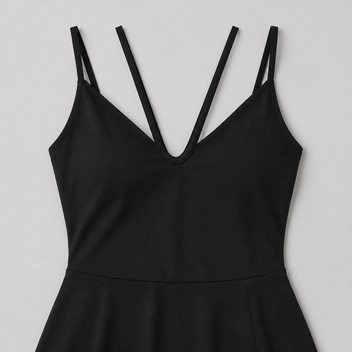 Black tennis mini dress neckline detail showing the four slender front strap segments.