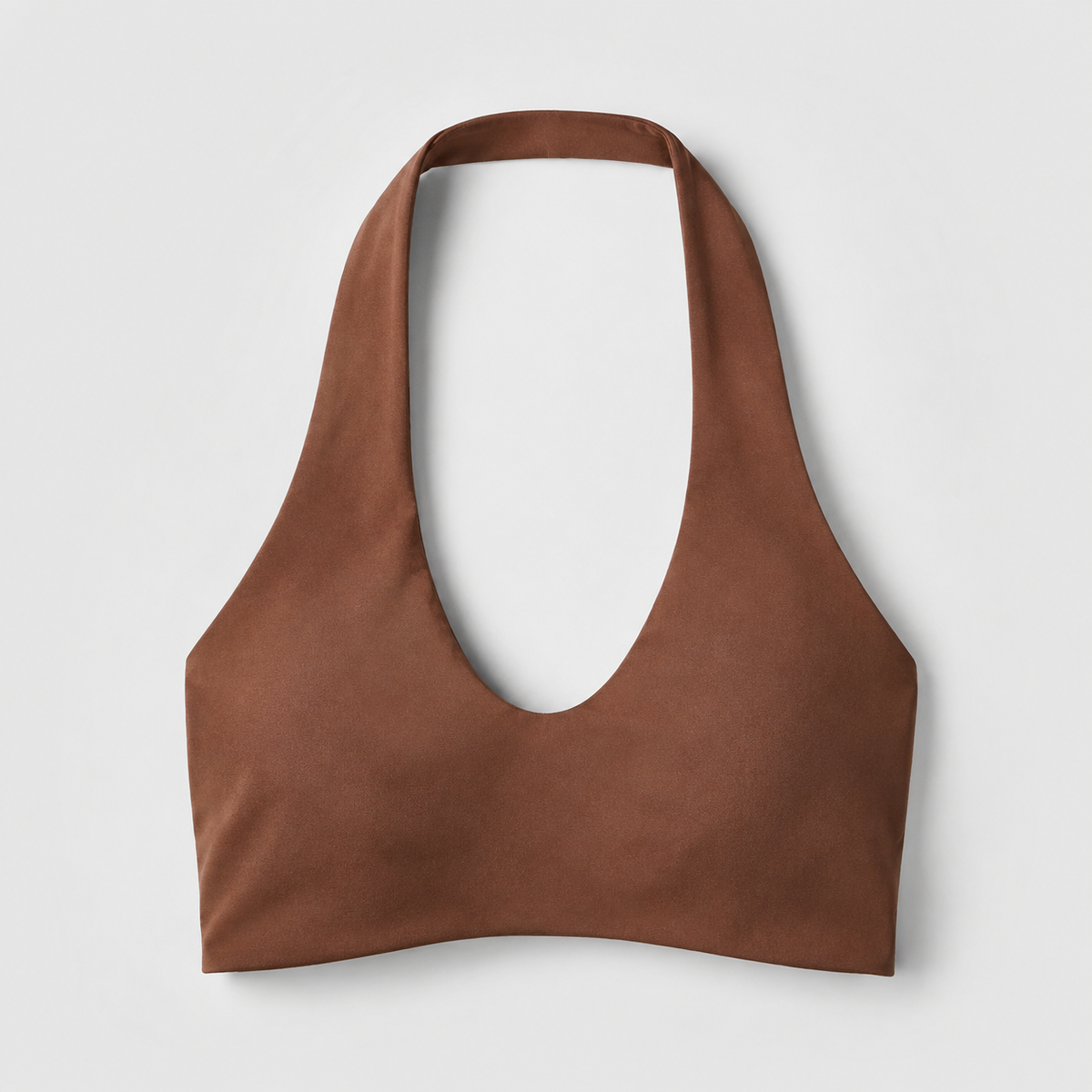 Brown halter sports bra front detail showing its rounded neckline and broad halter straps.