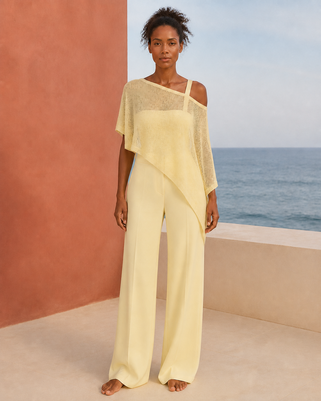 Yellow knit and sheer batwing poncho, front view on a third model