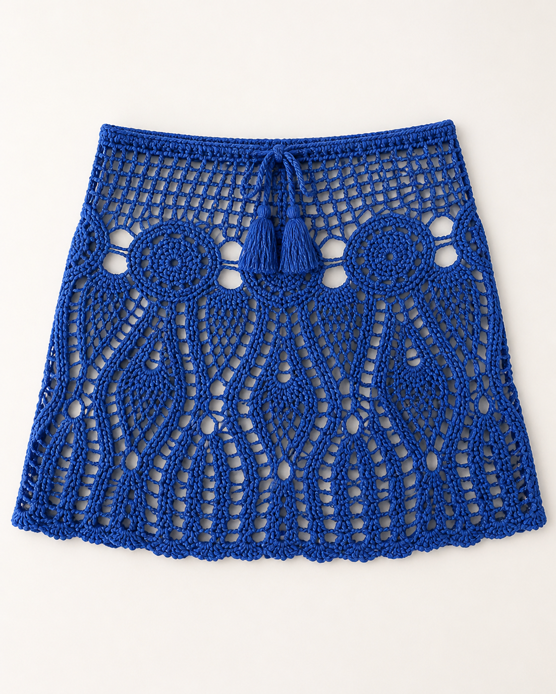 Blue crochet mini beach skirt, flat lay, full garment shown