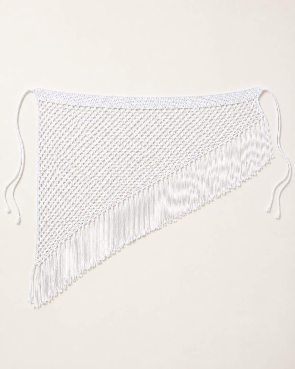 White crochet and fishnet beach skirt, flat lay, full garment shown